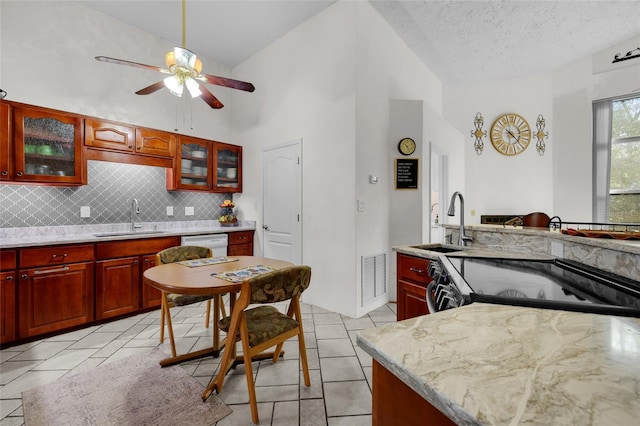 4250 NW 81st Ln, Bell, FL 32619 - kitchen featuring ceiling fan, tasteful backsplash, dark brown cabinets, visible vents, and a sink