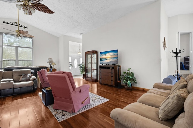 4250 NW 81st Ln, Bell, FL 32619 - living room featuring baseboards, ceiling fan, a textured ceiling, vaulted ceiling, and wood finished floors
