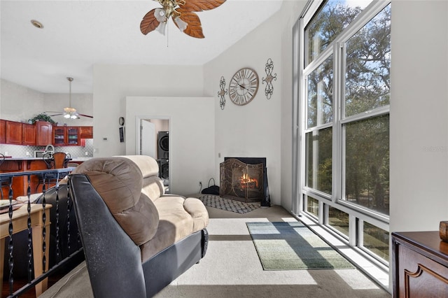 4250 NW 81st Ln, Bell, FL 32619 - living room with stacked washing maching and dryer, ceiling fan, and carpet flooring