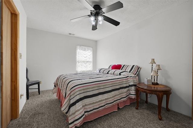 4250 NW 81st Ln, Bell, FL 32619 - bedroom featuring visible vents, ceiling fan, carpet, and a textured ceiling