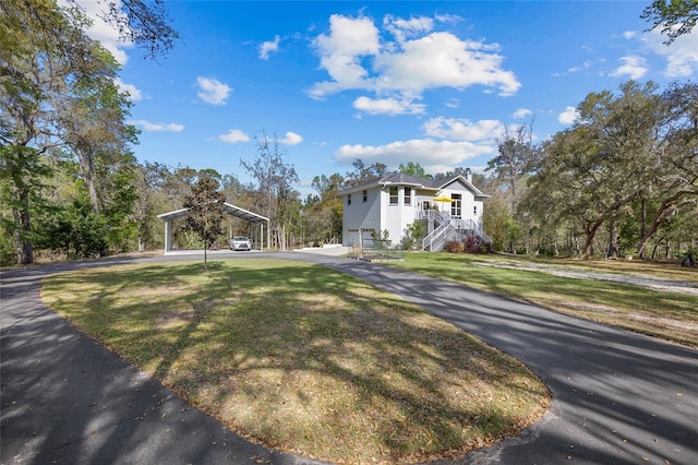 4250 NW 81st Ln, Bell, FL 32619 - view of front of property with a front yard, a detached carport, and stairs