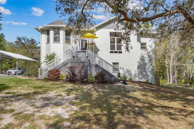 4250 NW 81st Ln, Bell, FL 32619 - back of property with stairway and stucco siding