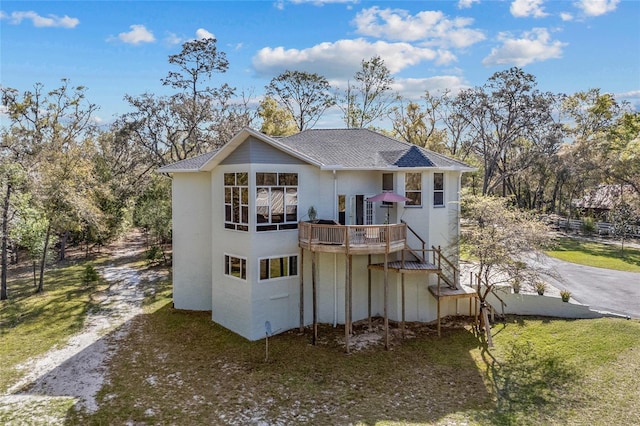 4250 NW 81st Ln, Bell, FL 32619 - view of front facade with stairs, a deck, a shingled roof, and dirt driveway