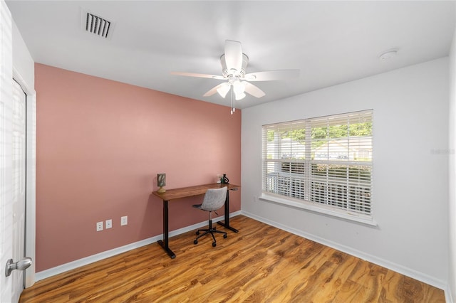 11764 NW 60th Dr, Alachua, FL 32615 - home office with a ceiling fan, baseboards, and wood finished floors