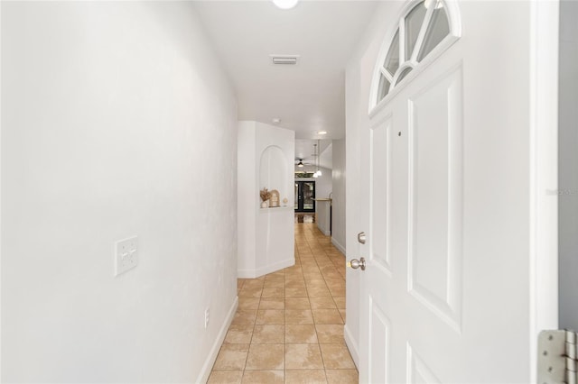 11764 NW 60th Dr, Alachua, FL 32615 - hallway featuring light tile patterned floors and baseboards