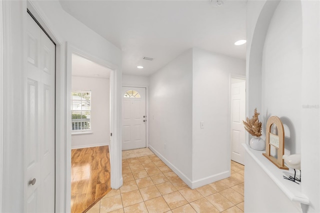 11764 NW 60th Dr, Alachua, FL 32615 - entryway with recessed lighting, baseboards, light tile patterned flooring, and arched walkways