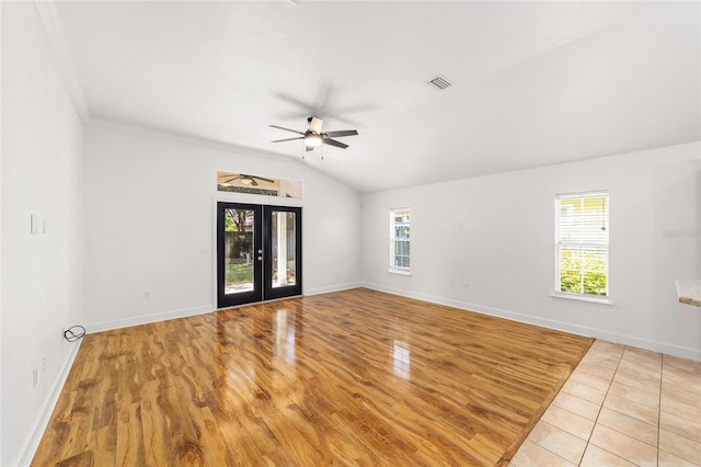 11764 NW 60th Dr, Alachua, FL 32615 - spare room with a ceiling fan, wood finished floors, baseboards, lofted ceiling, and french doors