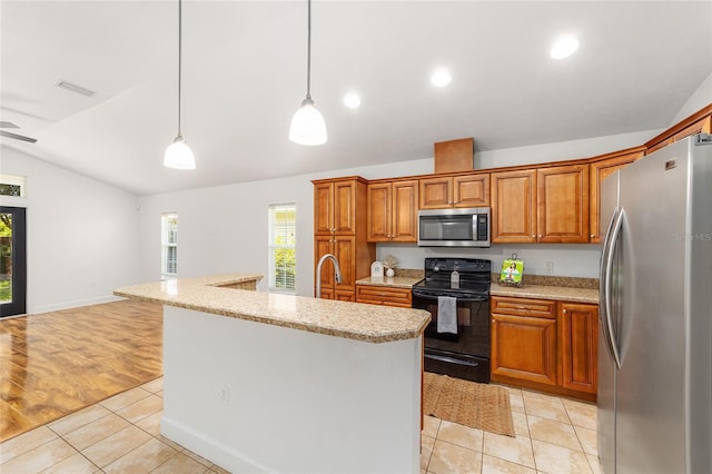 11764 NW 60th Dr, Alachua, FL 32615 - kitchen featuring appliances with stainless steel finishes, vaulted ceiling, brown cabinets, decorative light fixtures, and a center island with sink