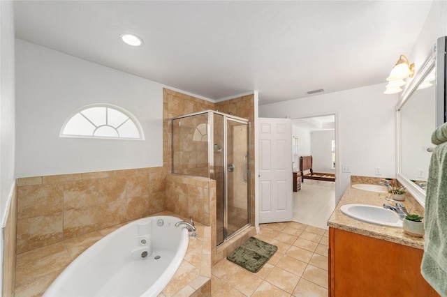 11764 NW 60th Dr, Alachua, FL 32615 - full bathroom with a whirlpool tub, a stall shower, tile patterned floors, and double vanity