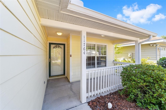 11764 NW 60th Dr, Alachua, FL 32615 - doorway to property with a porch