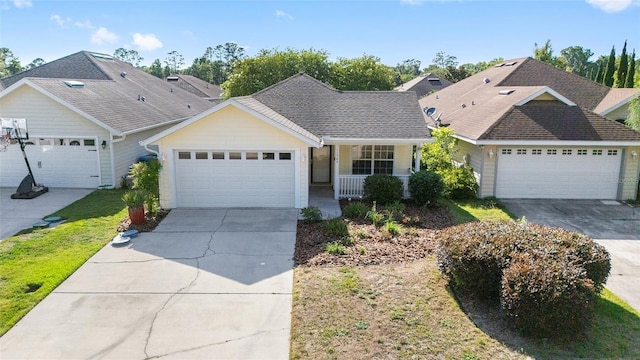 11764 NW 60th Dr, Alachua, FL 32615 - ranch-style home featuring concrete driveway, a porch, an attached garage, and a front lawn