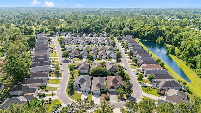 11764 NW 60th Dr, Alachua, FL 32615 - aerial overview of property's location with nearby suburban area, a nearby body of water, and a heavily wooded area