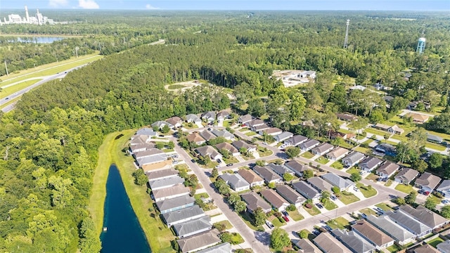 11764 NW 60th Dr, Alachua, FL 32615 - aerial view of property and surrounding area featuring a heavily wooded area, a nearby body of water, and nearby suburban area