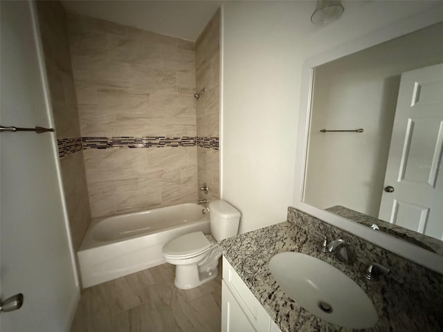 bathroom with toilet, shower / washtub combination, and vanity