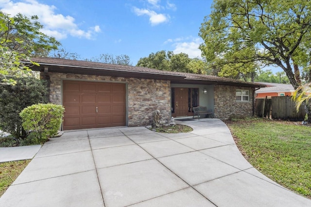 841 N Palm Springs Ter, Crystal River, FL 34429 - view of front of property with fence, driveway, a garage, and stone siding