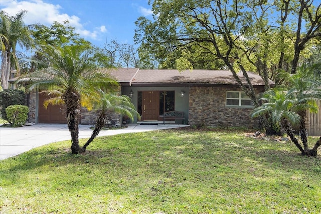 841 N Palm Springs Ter, Crystal River, FL 34429 - ranch-style house with an attached garage, stone siding, driveway, and a front lawn