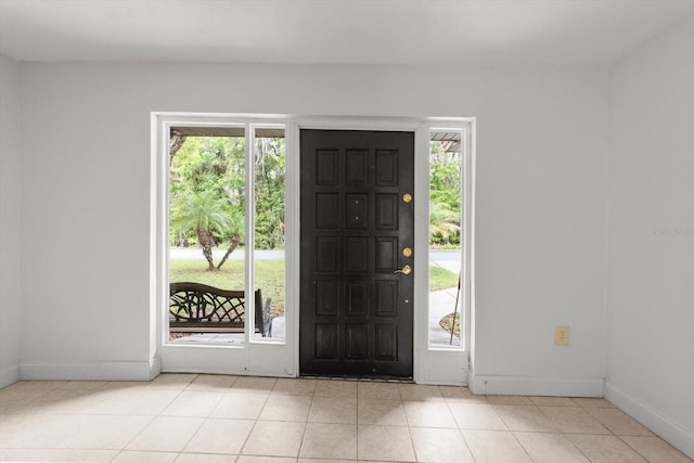 841 N Palm Springs Ter, Crystal River, FL 34429 - entryway featuring light tile patterned floors and baseboards