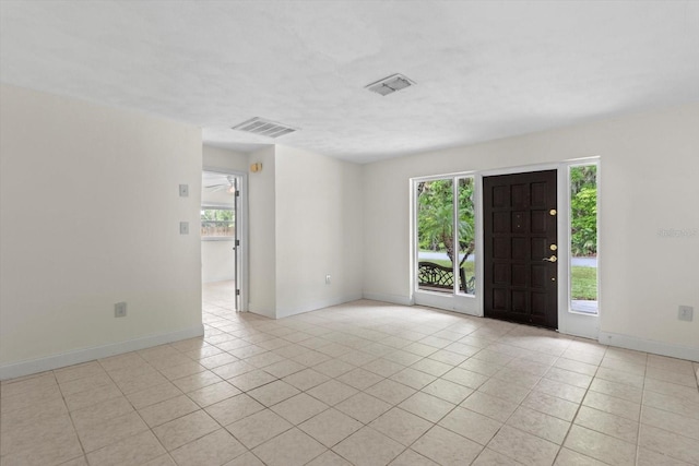 841 N Palm Springs Ter, Crystal River, FL 34429 - foyer with plenty of natural light, light tile patterned floors, and visible vents