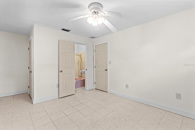 841 N Palm Springs Ter, Crystal River, FL 34429 - unfurnished bedroom featuring visible vents, baseboards, a ceiling fan, and connected bathroom