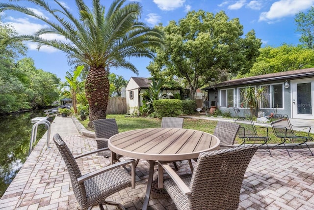 841 N Palm Springs Ter, Crystal River, FL 34429 - view of patio / terrace featuring fence and outdoor dining area