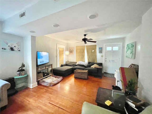 1035 NE 3rd Ave, Gainesville, FL 32601 - living room with wood finished floors, ceiling fan, and baseboards