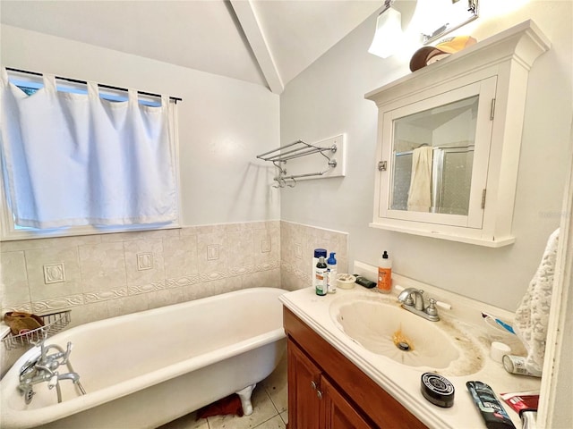 1035 NE 3rd Ave, Gainesville, FL 32601 - full bathroom featuring a freestanding tub, vanity, tile patterned floors, and a stall shower