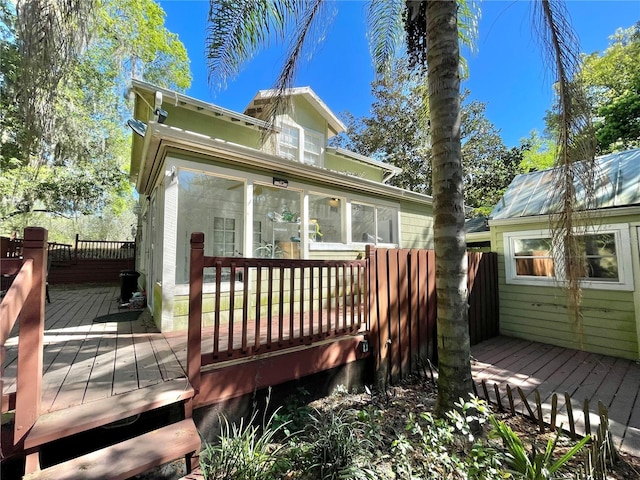 1035 NE 3rd Ave, Gainesville, FL 32601 - wooden deck with a sunroom