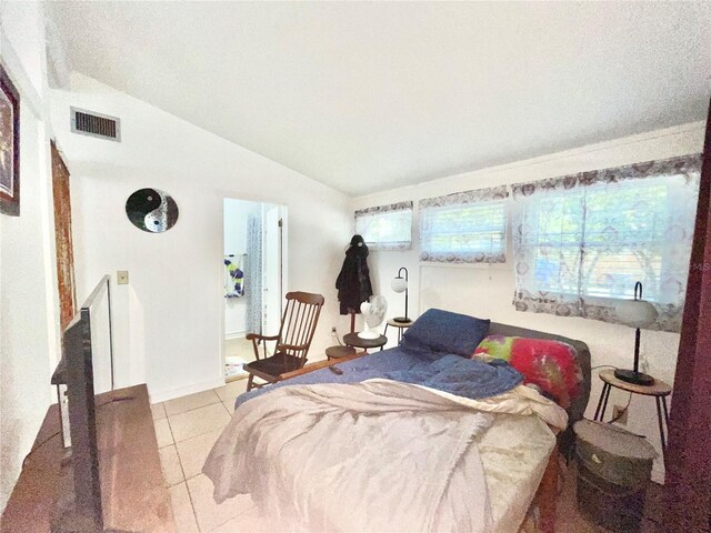 1035 NE 3rd Ave, Gainesville, FL 32601 - tiled bedroom with vaulted ceiling