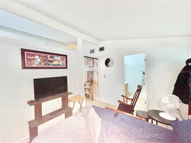 1035 NE 3rd Ave, Gainesville, FL 32601 - sitting room with vaulted ceiling, tile patterned flooring, and baseboards
