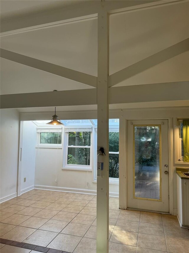 1035 NE 3rd Ave, Gainesville, FL 32601 - doorway with lofted ceiling and light tile patterned floors