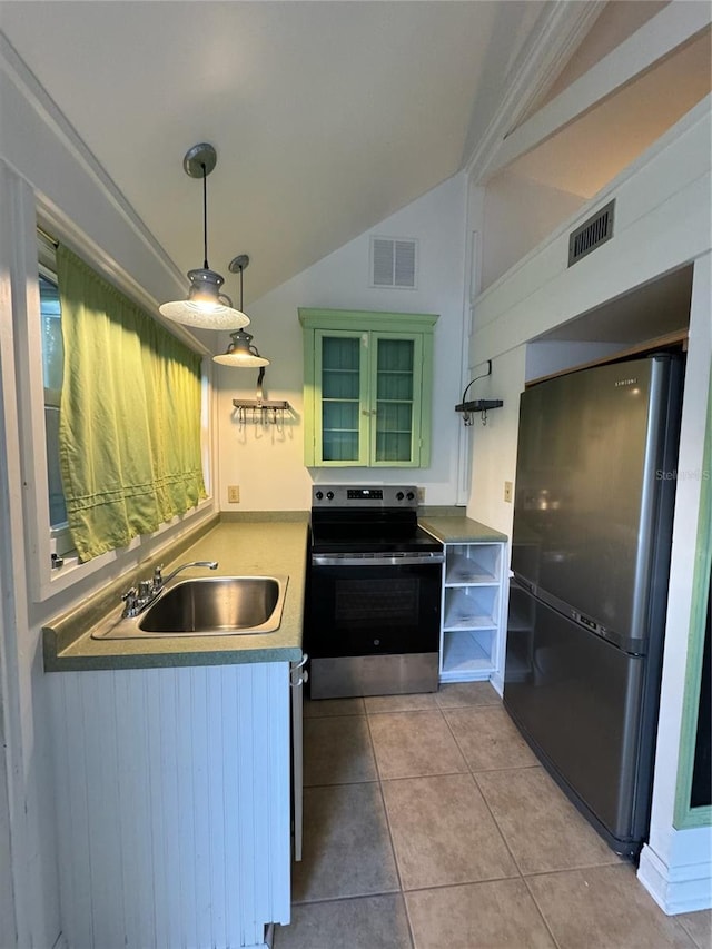 1035 NE 3rd Ave, Gainesville, FL 32601 - kitchen with freestanding refrigerator, stainless steel electric range oven, a sink, green cabinets, and open shelves
