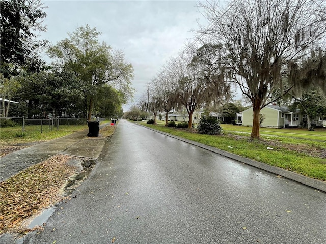 1035 NE 3rd Ave, Gainesville, FL 32601 - view of asphalt road with curbs and sidewalks