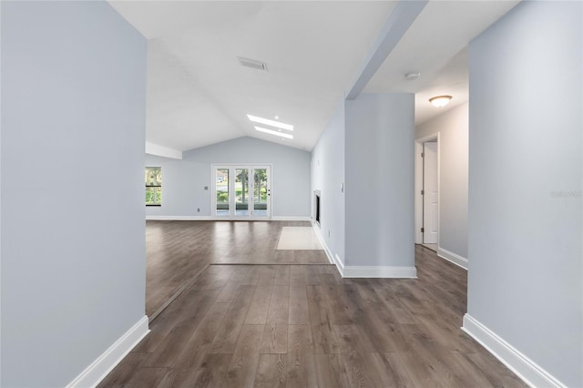 6840 NW 111th Ln, Alachua, FL 32615 - interior space with visible vents, baseboards, lofted ceiling with skylight, and wood finished floors