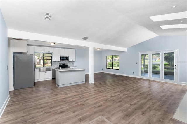 6840 NW 111th Ln, Alachua, FL 32615 - kitchen featuring open floor plan, baseboards, and appliances with stainless steel finishes