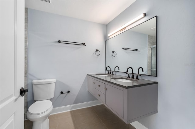 6840 NW 111th Ln, Alachua, FL 32615 - full bath featuring a sink, toilet, double vanity, and baseboards
