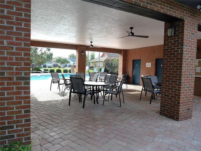 8941 SW 73rd Ln, Gainesville, FL 32608 - view of patio / terrace featuring a ceiling fan and a community pool