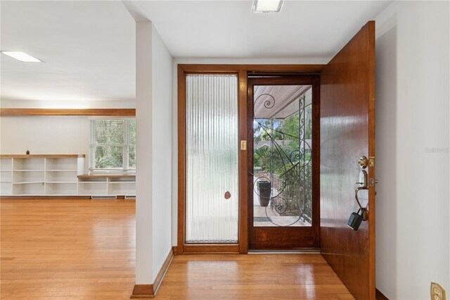 2210 NW 6th Pl, Gainesville, FL 32603 - foyer entrance with hardwood / wood-style floors and plenty of natural light