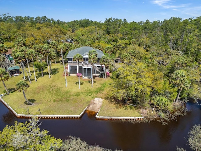 bird's eye view with a water view and a forest view
