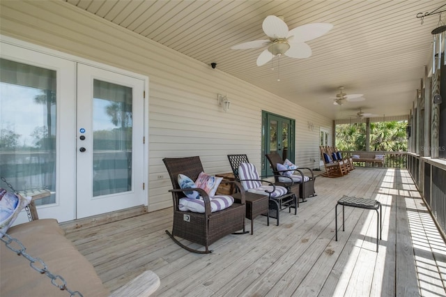 deck featuring french doors and ceiling fan