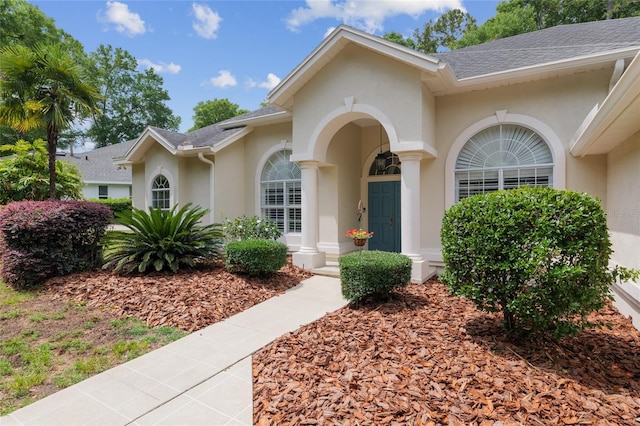 3802 SW 93rd Ter, Gainesville, FL 32608 - entrance to property featuring stucco siding and a shingled roof
