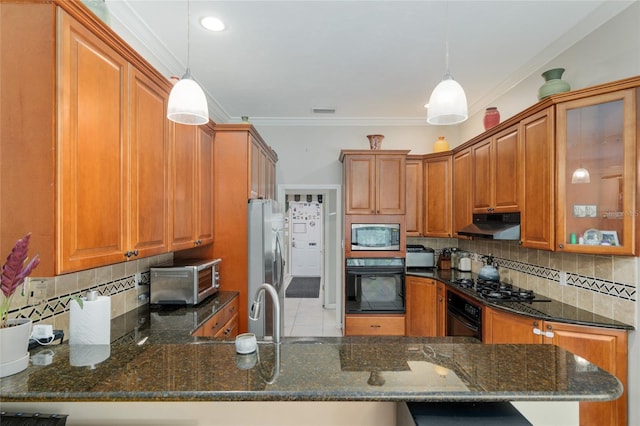 3802 SW 93rd Ter, Gainesville, FL 32608 - kitchen with black appliances, brown cabinetry, dark stone counters, tasteful backsplash, and ornamental molding
