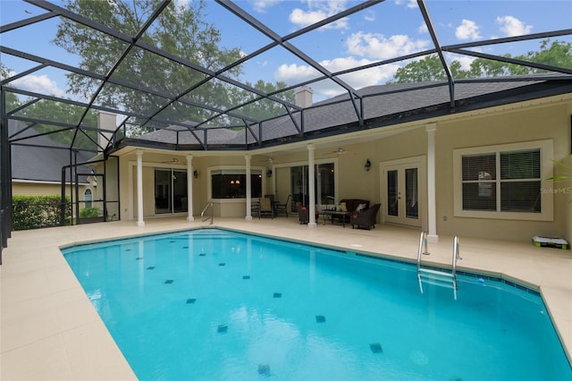 3802 SW 93rd Ter, Gainesville, FL 32608 - swimming pool with french doors, ceiling fan, a patio area, an outdoor living space, and a lanai