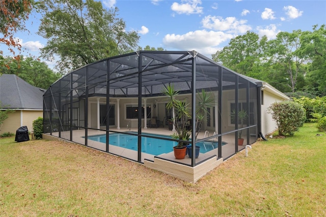 3802 SW 93rd Ter, Gainesville, FL 32608 - swimming pool featuring a patio, a yard, and glass enclosure