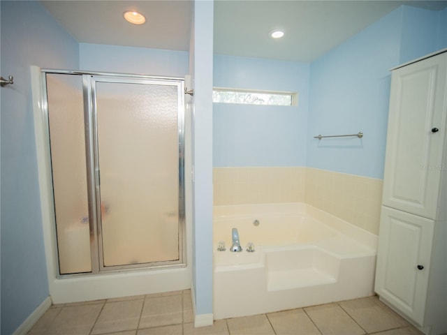 bathroom featuring a bath, tile patterned floors, a stall shower, and recessed lighting