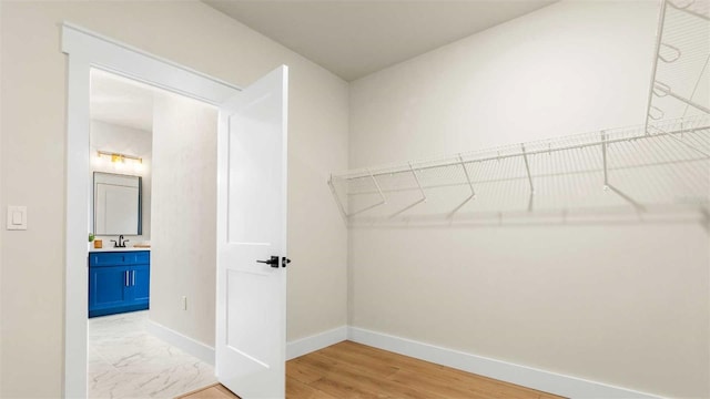 10055 Fox Hollow Dr, Hampton, FL 32044 - walk in closet featuring marble finish floor and a sink
