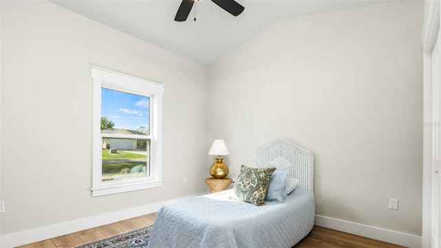 10055 Fox Hollow Dr, Hampton, FL 32044 - living area featuring vaulted ceiling, baseboards, wood finished floors, and ceiling fan