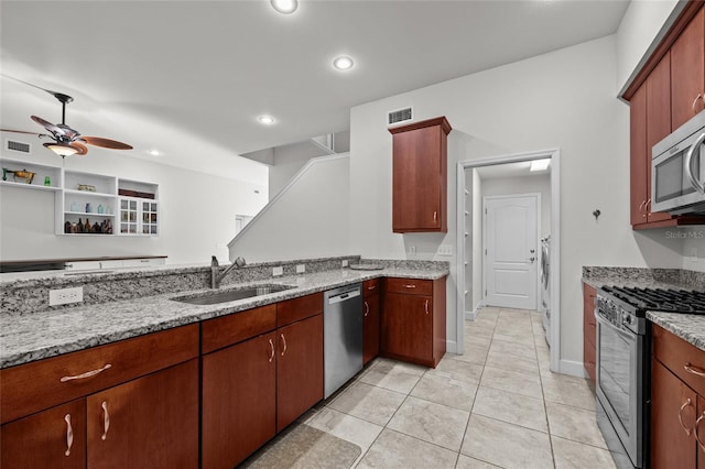 6382 SW 48th Dr, Gainesville, FL 32608 - kitchen featuring appliances with stainless steel finishes, light stone counters, ceiling fan, recessed lighting, and light tile patterned floors