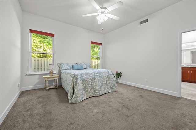 6382 SW 48th Dr, Gainesville, FL 32608 - bedroom featuring carpet flooring, ensuite bath, and a ceiling fan