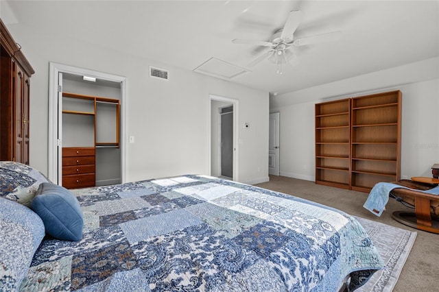 6382 SW 48th Dr, Gainesville, FL 32608 - carpeted bedroom featuring attic access, ceiling fan, a spacious closet, and a closet