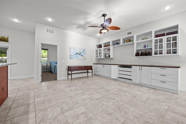 6382 SW 48th Dr, Gainesville, FL 32608 - kitchen with open shelves, a ceiling fan, recessed lighting, white cabinetry, and dark countertops